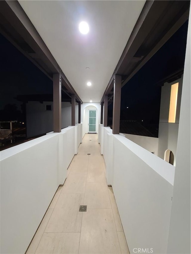 hallway with light tile patterned floors