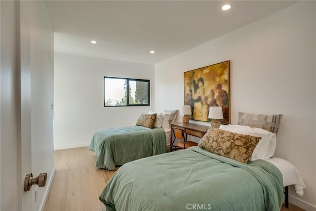 bedroom with light hardwood / wood-style floors