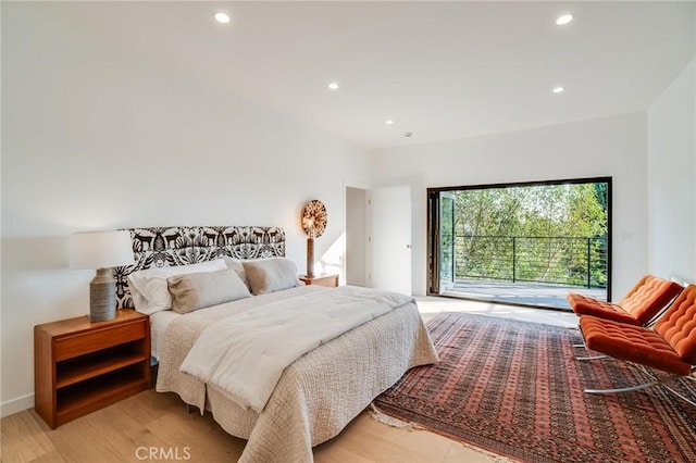 bedroom with light hardwood / wood-style floors and access to outside