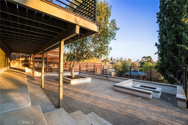 view of patio / terrace with an outdoor fire pit