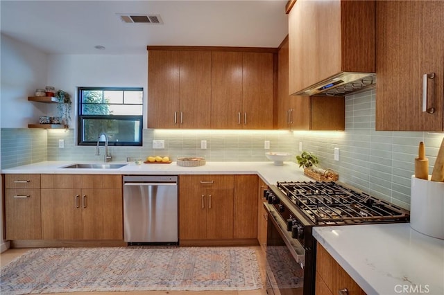 kitchen with sink, dishwasher, backsplash, extractor fan, and gas stove