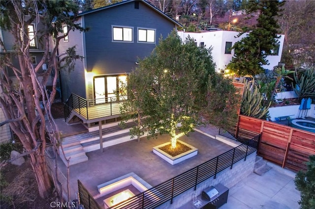 view of patio / terrace featuring a hot tub and central air condition unit