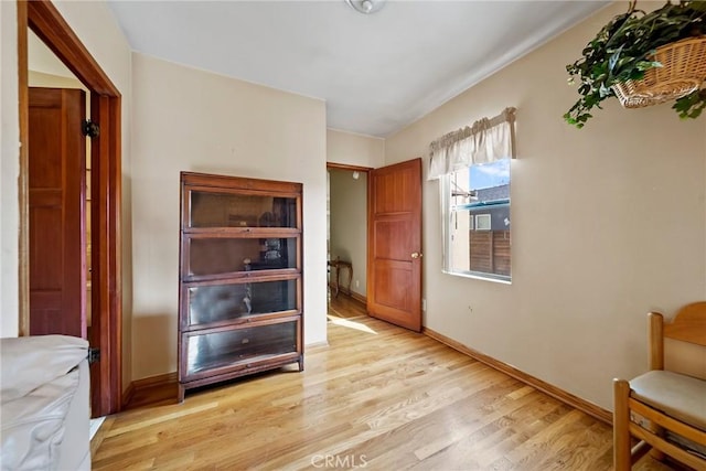 living area with light hardwood / wood-style flooring