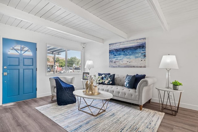 living room with beamed ceiling, hardwood / wood-style flooring, and wood ceiling