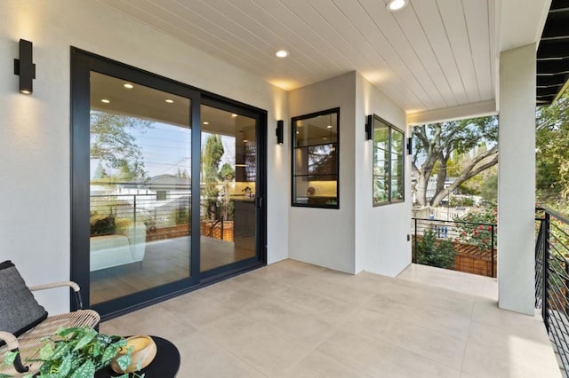 exterior space with wood ceiling