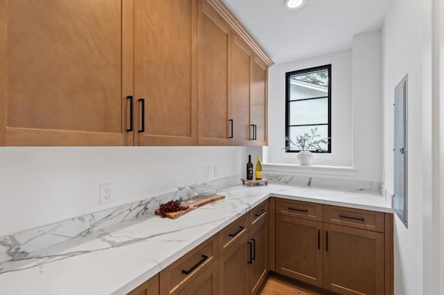 kitchen featuring light stone countertops