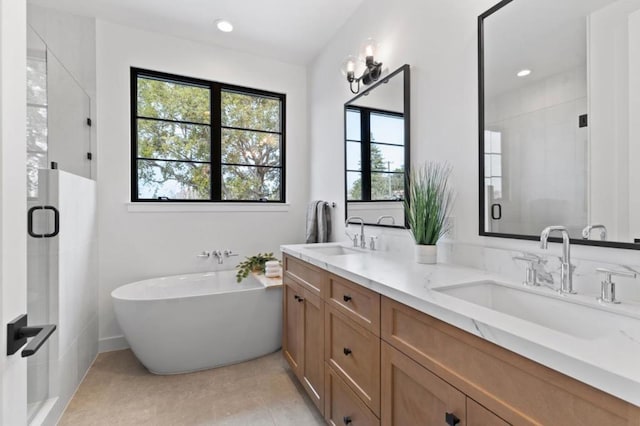 bathroom featuring vanity, tile patterned flooring, and independent shower and bath