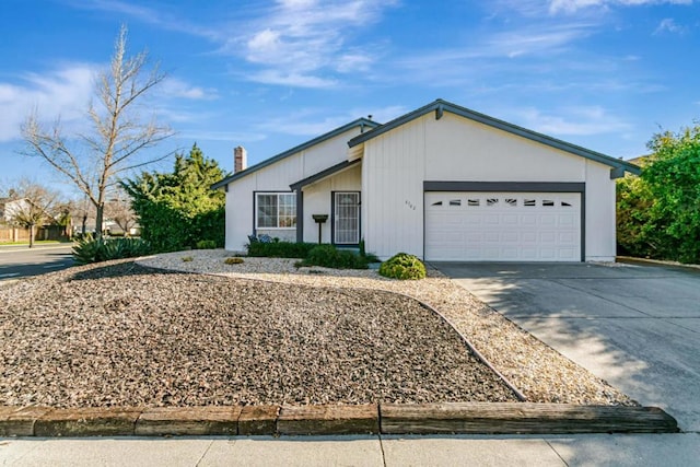 ranch-style house featuring a garage