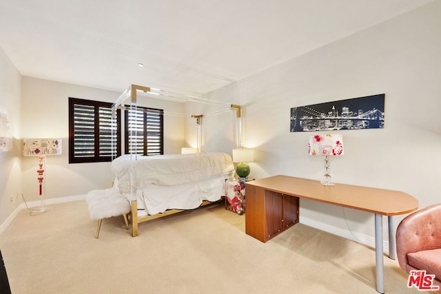 bedroom with light colored carpet