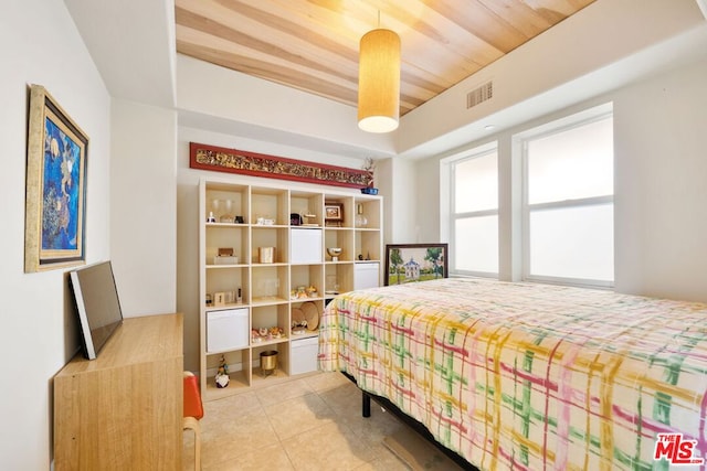 tiled bedroom featuring wooden ceiling