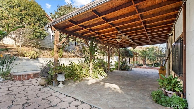 view of patio / terrace featuring fence