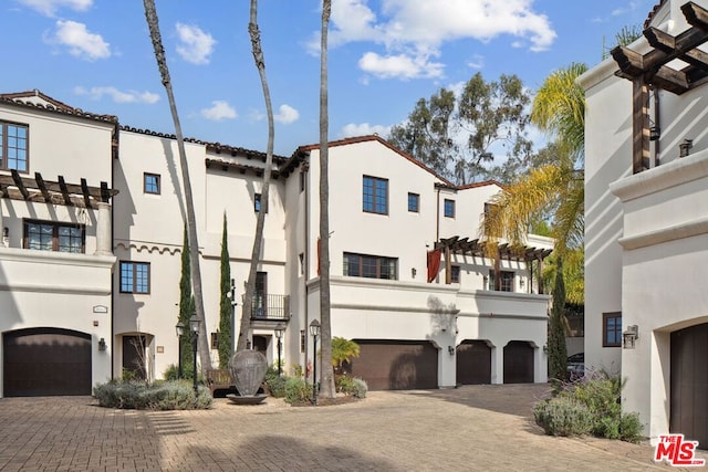 mediterranean / spanish-style house featuring a garage