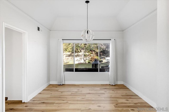 unfurnished dining area with vaulted ceiling and light hardwood / wood-style floors