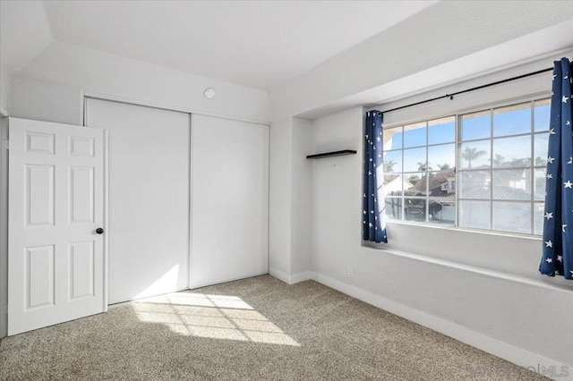 unfurnished bedroom with a closet and carpet