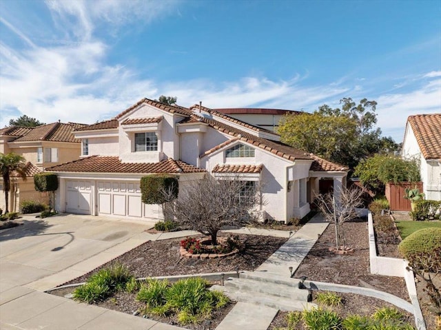 mediterranean / spanish-style house featuring a garage