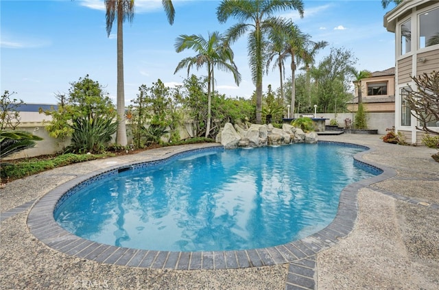 outdoor pool featuring a patio area