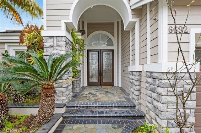 property entrance featuring french doors