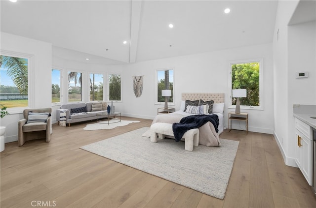 bedroom with high vaulted ceiling, light wood finished floors, recessed lighting, and baseboards