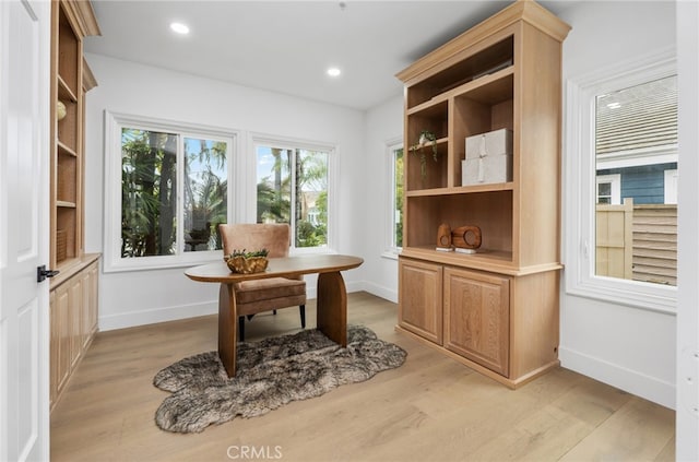 home office with baseboards, light wood-type flooring, and recessed lighting