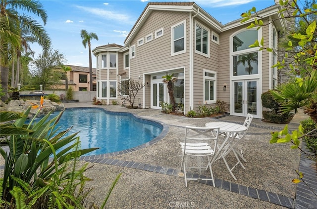 pool featuring a patio and french doors