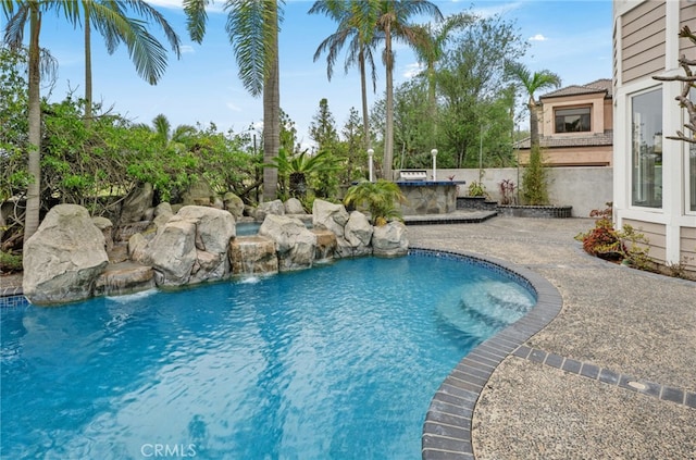 outdoor pool featuring area for grilling