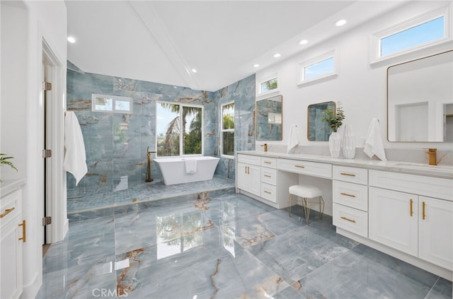 full bathroom featuring plenty of natural light, marble finish floor, a sink, and double vanity