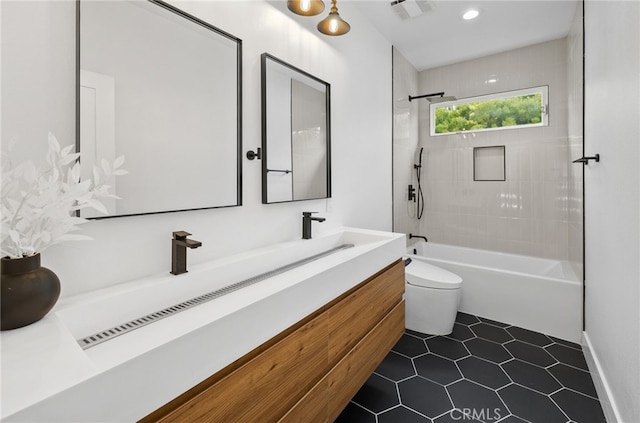 bathroom featuring toilet, shower / bath combination, visible vents, tile patterned floors, and double vanity