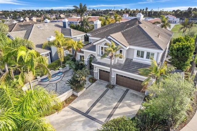 birds eye view of property with a residential view