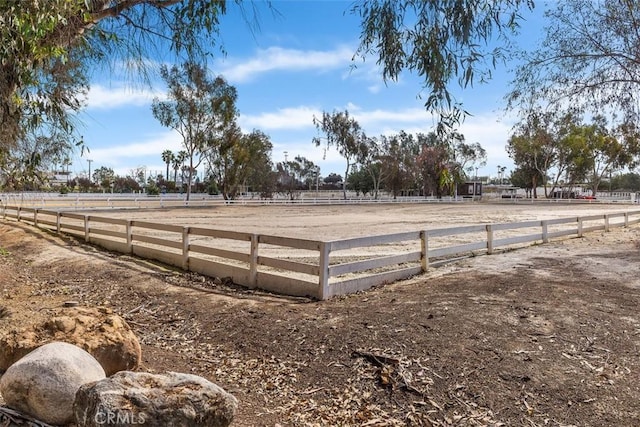 view of yard featuring an enclosed area and a rural view