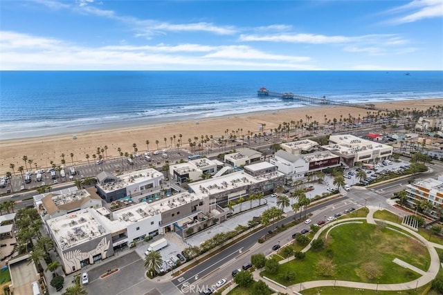 bird's eye view featuring a water view and a view of the beach