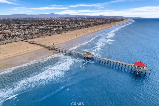 bird's eye view with a water and mountain view and a view of the beach