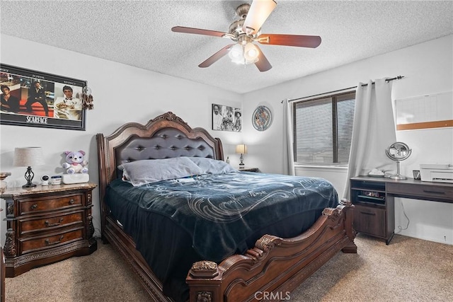 bedroom with ceiling fan, light carpet, and a textured ceiling