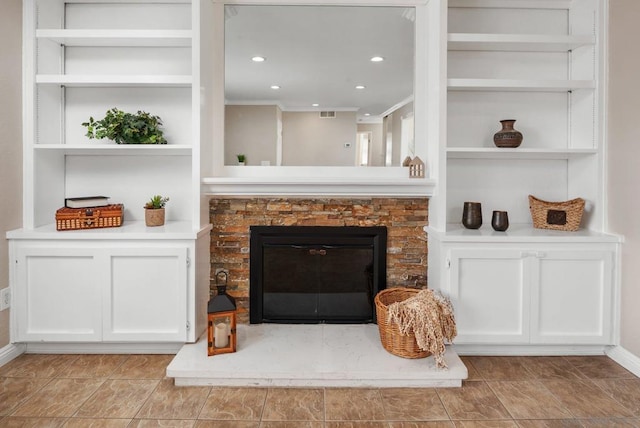 living room featuring crown molding and built in features