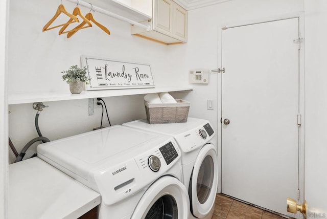 washroom featuring cabinets and separate washer and dryer