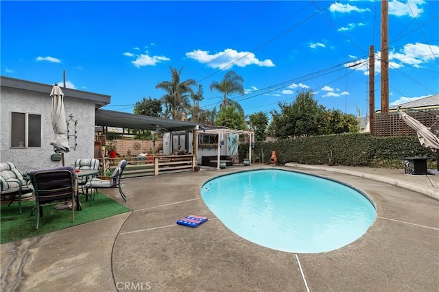 view of pool with a pergola and a patio area