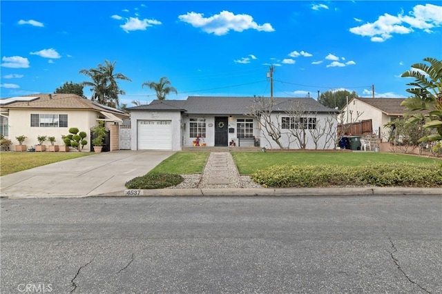 ranch-style house with a garage and a front lawn