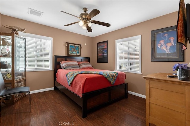 bedroom featuring dark wood-type flooring and ceiling fan