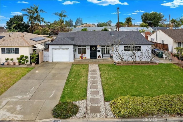 ranch-style house featuring a garage and a front yard