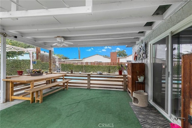 view of patio featuring ceiling fan