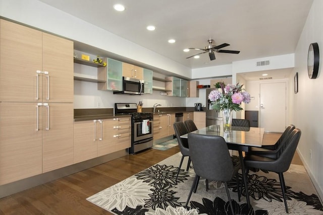 kitchen with sink, light brown cabinets, dark hardwood / wood-style flooring, ceiling fan, and stainless steel appliances