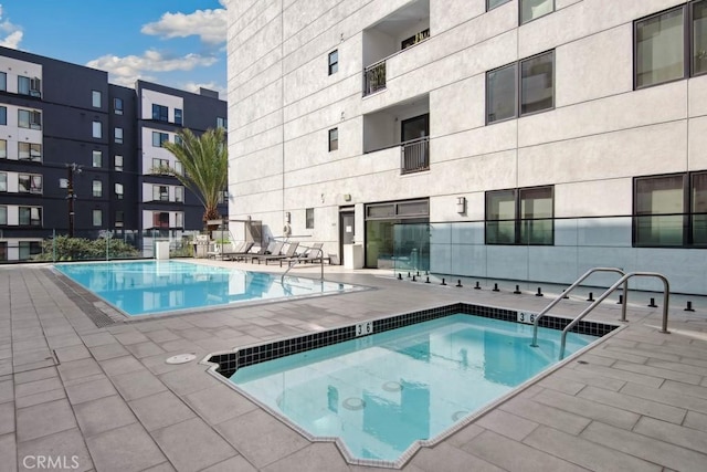 view of swimming pool with a patio