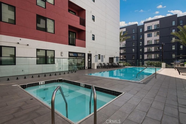 view of swimming pool with a patio area