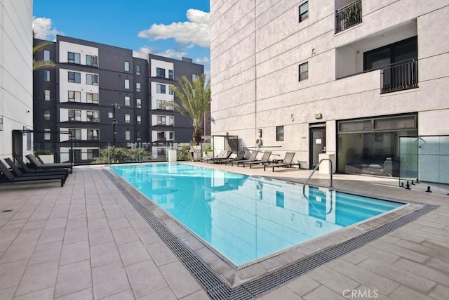 view of swimming pool featuring a patio area