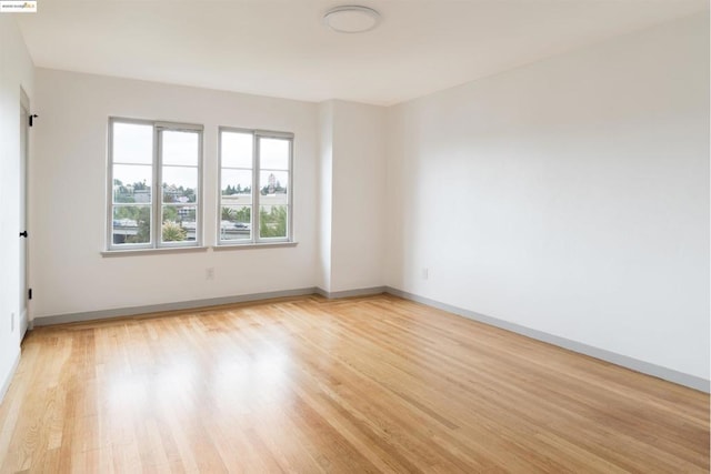 spare room with light hardwood / wood-style floors