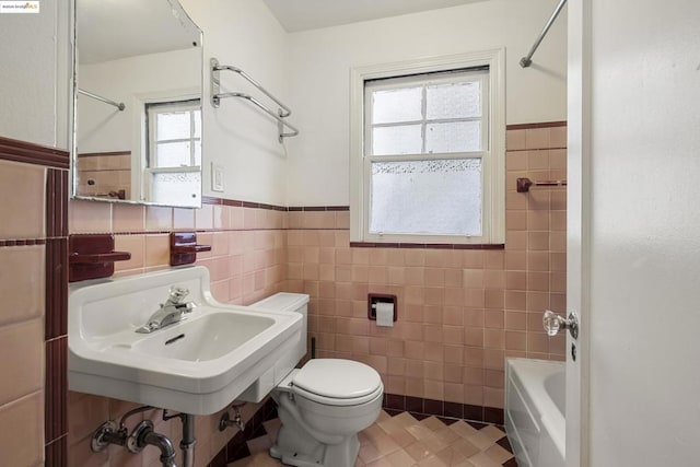 full bathroom featuring tile walls, sink, tile patterned flooring, and toilet