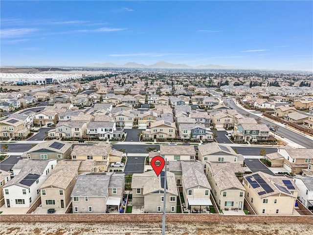 birds eye view of property featuring a mountain view and a residential view