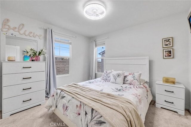 bedroom featuring light carpet