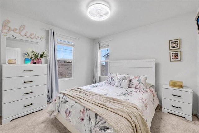 bedroom featuring light colored carpet