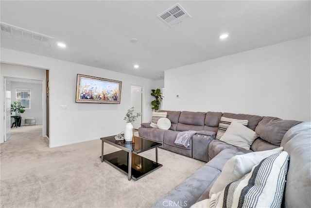 living room with light carpet, visible vents, and recessed lighting