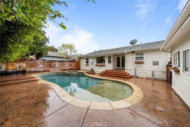 view of swimming pool with a patio area and french doors